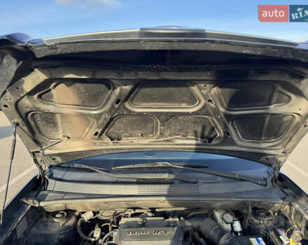 Черный Хендай Туксон, объемом двигателя 1.98 л и пробегом 218 тыс. км за 9350 $, фото 10 на Automoto.ua