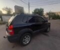 Черный Хендай Туксон, объемом двигателя 2 л и пробегом 290 тыс. км за 8500 $, фото 1 на Automoto.ua