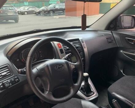 Черный Хендай Туксон, объемом двигателя 1.98 л и пробегом 312 тыс. км за 8500 $, фото 22 на Automoto.ua
