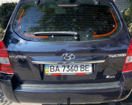 Черный Хендай Туксон, объемом двигателя 1.98 л и пробегом 245 тыс. км за 9000 $, фото 2 на Automoto.ua
