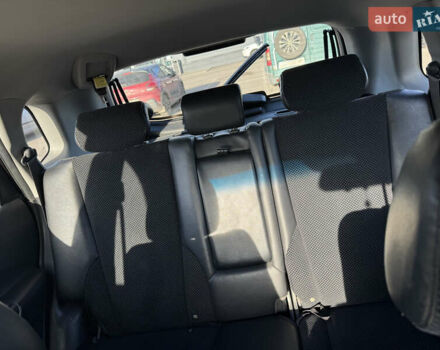 Черный Хендай Туксон, объемом двигателя 1.98 л и пробегом 218 тыс. км за 9350 $, фото 14 на Automoto.ua