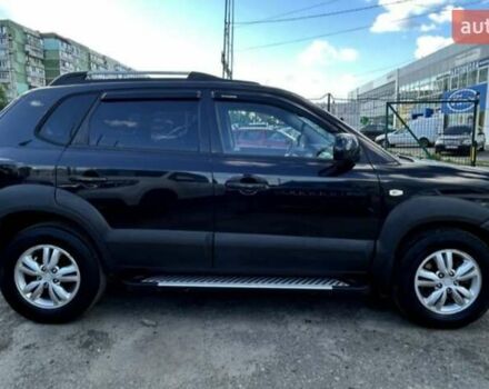 Черный Хендай Туксон, объемом двигателя 1.98 л и пробегом 186 тыс. км за 9500 $, фото 5 на Automoto.ua