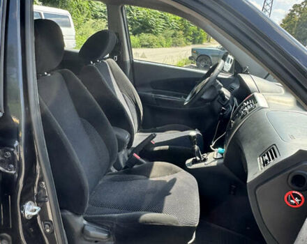 Черный Хендай Туксон, объемом двигателя 1.98 л и пробегом 252 тыс. км за 7999 $, фото 16 на Automoto.ua