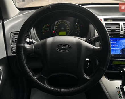 Черный Хендай Туксон, объемом двигателя 1.98 л и пробегом 129 тыс. км за 10600 $, фото 8 на Automoto.ua