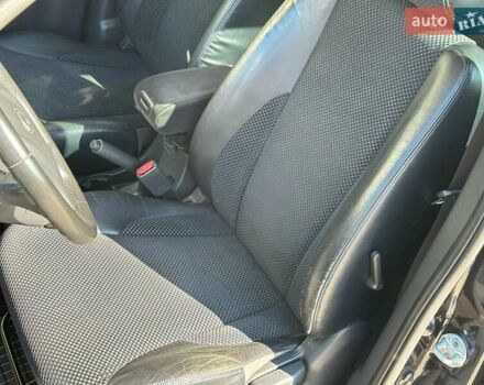 Черный Хендай Туксон, объемом двигателя 2 л и пробегом 255 тыс. км за 9290 $, фото 12 на Automoto.ua