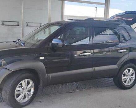 Черный Хендай Туксон, объемом двигателя 2 л и пробегом 141 тыс. км за 8500 $, фото 5 на Automoto.ua