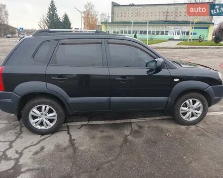 Черный Хендай Туксон, объемом двигателя 1.98 л и пробегом 214 тыс. км за 9100 $, фото 9 на Automoto.ua