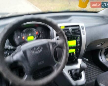 Чорний Хендай Туксон, об'ємом двигуна 1.98 л та пробігом 160 тис. км за 10300 $, фото 100 на Automoto.ua