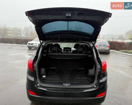 Черный Хендай Туксон, объемом двигателя 2.4 л и пробегом 143 тыс. км за 12000 $, фото 20 на Automoto.ua