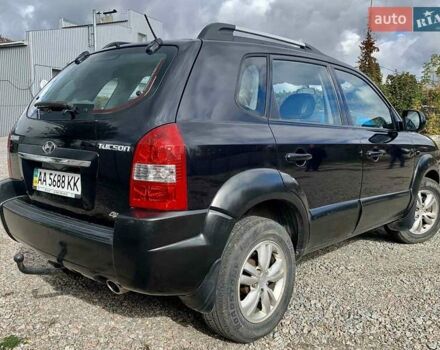 Черный Хендай Туксон, объемом двигателя 1.98 л и пробегом 158 тыс. км за 8200 $, фото 6 на Automoto.ua