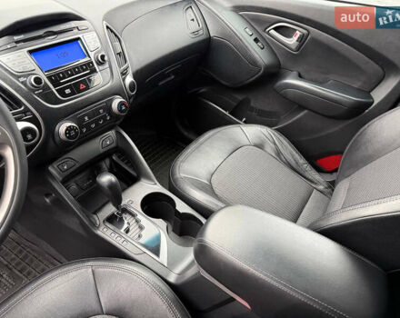 Черный Хендай Туксон, объемом двигателя 2.4 л и пробегом 143 тыс. км за 12000 $, фото 17 на Automoto.ua