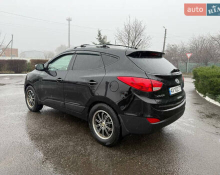 Черный Хендай Туксон, объемом двигателя 2.4 л и пробегом 143 тыс. км за 12000 $, фото 11 на Automoto.ua