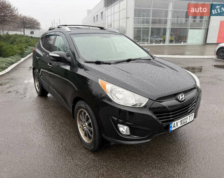 Черный Хендай Туксон, объемом двигателя 2.4 л и пробегом 143 тыс. км за 12000 $, фото 3 на Automoto.ua