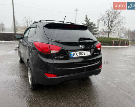 Черный Хендай Туксон, объемом двигателя 2.4 л и пробегом 143 тыс. км за 12000 $, фото 12 на Automoto.ua