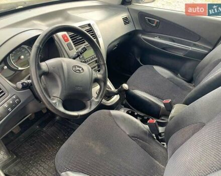 Черный Хендай Туксон, объемом двигателя 1.98 л и пробегом 158 тыс. км за 8200 $, фото 22 на Automoto.ua