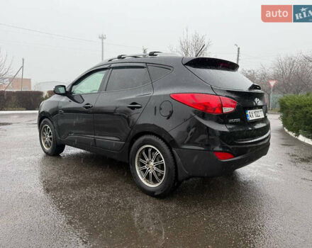 Черный Хендай Туксон, объемом двигателя 2.4 л и пробегом 143 тыс. км за 12000 $, фото 10 на Automoto.ua