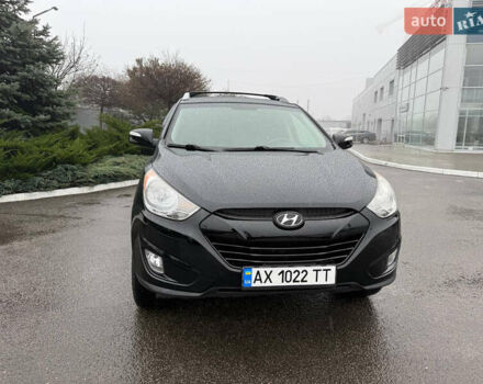 Черный Хендай Туксон, объемом двигателя 2.4 л и пробегом 143 тыс. км за 12000 $, фото 1 на Automoto.ua