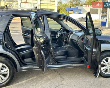 Черный Хендай Туксон, объемом двигателя 2 л и пробегом 119 тыс. км за 9600 $, фото 6 на Automoto.ua