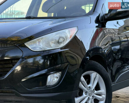 Черный Хендай Туксон, объемом двигателя 2.36 л и пробегом 299 тыс. км за 9800 $, фото 2 на Automoto.ua