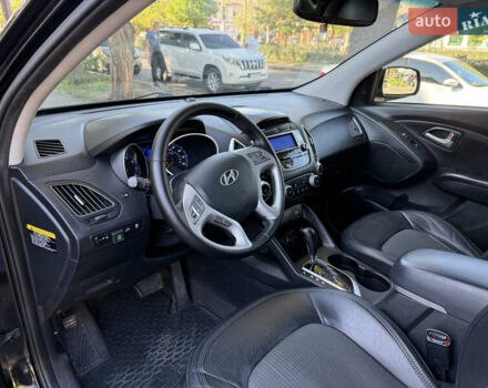 Черный Хендай Туксон, объемом двигателя 2.36 л и пробегом 299 тыс. км за 9800 $, фото 11 на Automoto.ua