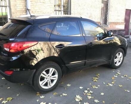 Черный Хендай Туксон, объемом двигателя 2.4 л и пробегом 132 тыс. км за 12900 $, фото 1 на Automoto.ua