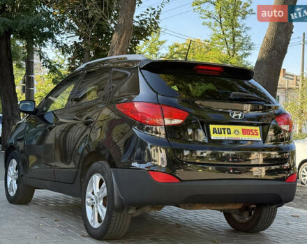 Черный Хендай Туксон, объемом двигателя 2.36 л и пробегом 299 тыс. км за 9800 $, фото 9 на Automoto.ua