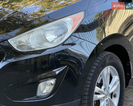 Черный Хендай Туксон, объемом двигателя 2.36 л и пробегом 299 тыс. км за 9800 $, фото 8 на Automoto.ua