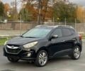 Черный Хендай Туксон, объемом двигателя 2.4 л и пробегом 80 тыс. км за 13000 $, фото 2 на Automoto.ua