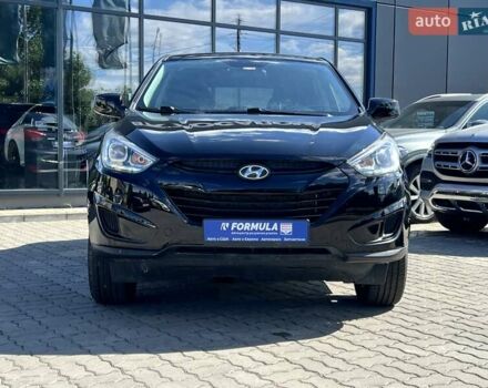 Чорний Хендай Туксон, об'ємом двигуна 2 л та пробігом 164 тис. км за 11490 $, фото 6 на Automoto.ua