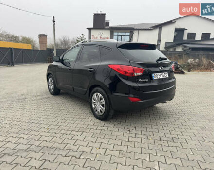 Черный Хендай Туксон, объемом двигателя 2.36 л и пробегом 205 тыс. км за 11200 $, фото 6 на Automoto.ua