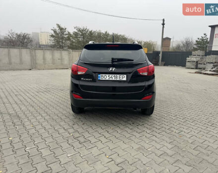Черный Хендай Туксон, объемом двигателя 2.36 л и пробегом 205 тыс. км за 11200 $, фото 5 на Automoto.ua