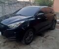 Черный Хендай Туксон, объемом двигателя 2 л и пробегом 180 тыс. км за 13500 $, фото 1 на Automoto.ua