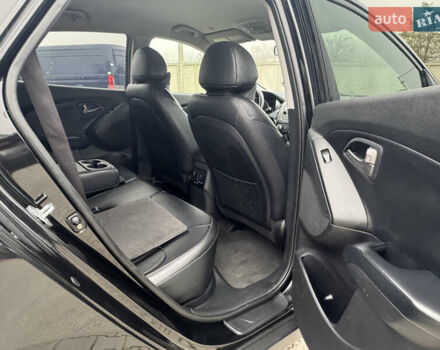 Черный Хендай Туксон, объемом двигателя 2.36 л и пробегом 205 тыс. км за 11200 $, фото 12 на Automoto.ua