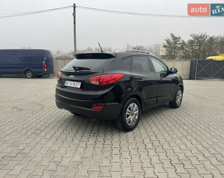 Черный Хендай Туксон, объемом двигателя 2.36 л и пробегом 205 тыс. км за 11200 $, фото 4 на Automoto.ua