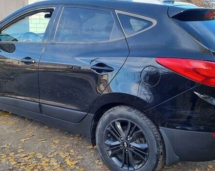 Черный Хендай Туксон, объемом двигателя 2.4 л и пробегом 200 тыс. км за 11000 $, фото 1 на Automoto.ua