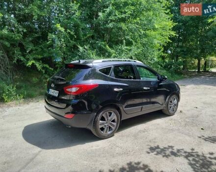 Черный Хендай Туксон, объемом двигателя 2.36 л и пробегом 118 тыс. км за 15000 $, фото 3 на Automoto.ua