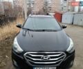 Черный Хендай Туксон, объемом двигателя 2.4 л и пробегом 128 тыс. км за 14000 $, фото 3 на Automoto.ua