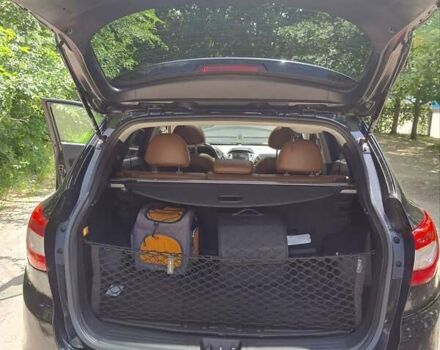 Черный Хендай Туксон, объемом двигателя 2.36 л и пробегом 118 тыс. км за 15000 $, фото 15 на Automoto.ua