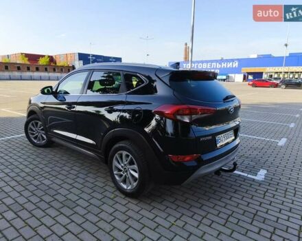 Черный Хендай Туксон, объемом двигателя 2 л и пробегом 215 тыс. км за 18900 $, фото 3 на Automoto.ua