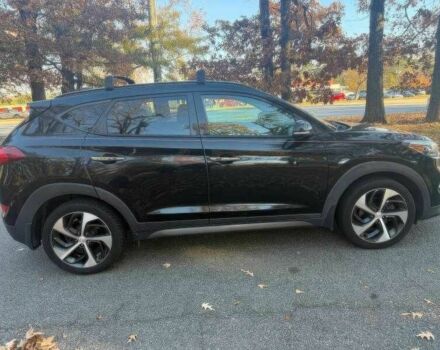 Черный Хендай Туксон, объемом двигателя 1.6 л и пробегом 99 тыс. км за 9600 $, фото 7 на Automoto.ua