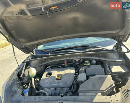 Черный Хендай Туксон, объемом двигателя 2 л и пробегом 180 тыс. км за 15900 $, фото 2 на Automoto.ua