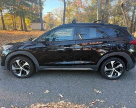 Черный Хендай Туксон, объемом двигателя 1.6 л и пробегом 99 тыс. км за 9600 $, фото 3 на Automoto.ua