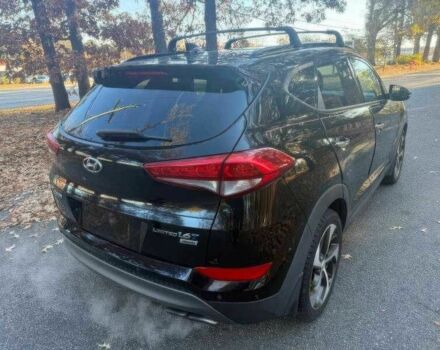 Черный Хендай Туксон, объемом двигателя 1.6 л и пробегом 99 тыс. км за 9600 $, фото 6 на Automoto.ua