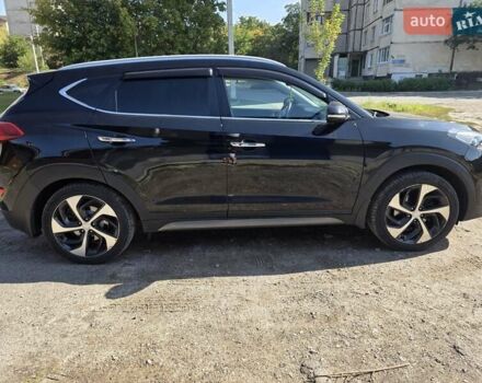 Черный Хендай Туксон, объемом двигателя 1.98 л и пробегом 112 тыс. км за 18300 $, фото 3 на Automoto.ua