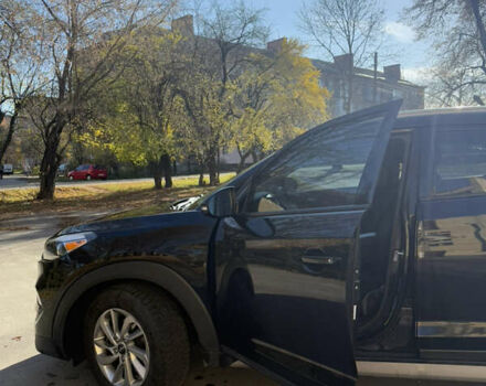 Черный Хендай Туксон, объемом двигателя 2 л и пробегом 100 тыс. км за 16300 $, фото 1 на Automoto.ua