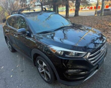 Черный Хендай Туксон, объемом двигателя 1.6 л и пробегом 99 тыс. км за 9600 $, фото 2 на Automoto.ua