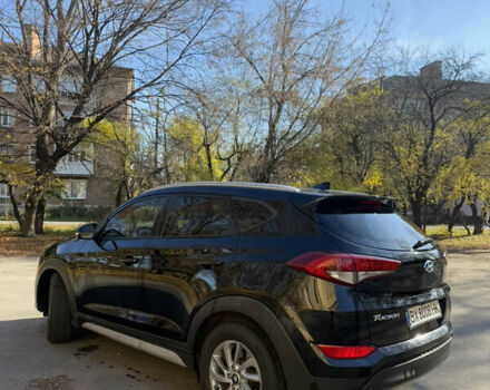 Черный Хендай Туксон, объемом двигателя 2 л и пробегом 100 тыс. км за 16300 $, фото 3 на Automoto.ua