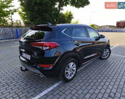 Черный Хендай Туксон, объемом двигателя 2 л и пробегом 215 тыс. км за 18900 $, фото 2 на Automoto.ua