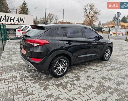 Черный Хендай Туксон, объемом двигателя 2 л и пробегом 178 тыс. км за 19200 $, фото 6 на Automoto.ua