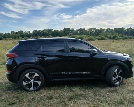 Чорний Хендай Туксон, об'ємом двигуна 2 л та пробігом 148 тис. км за 17800 $, фото 4 на Automoto.ua